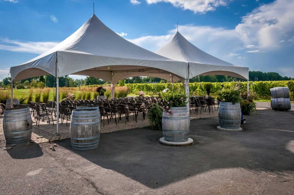 Tent rental for outdoor event party with wine barrels