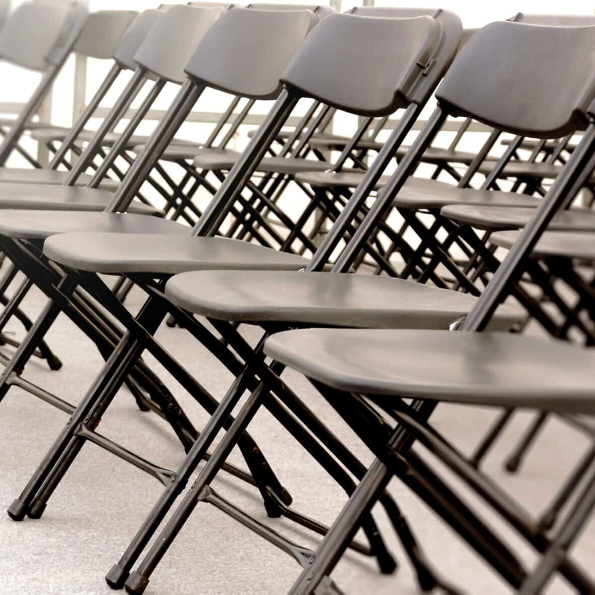 Black Folding Chairs in a Row