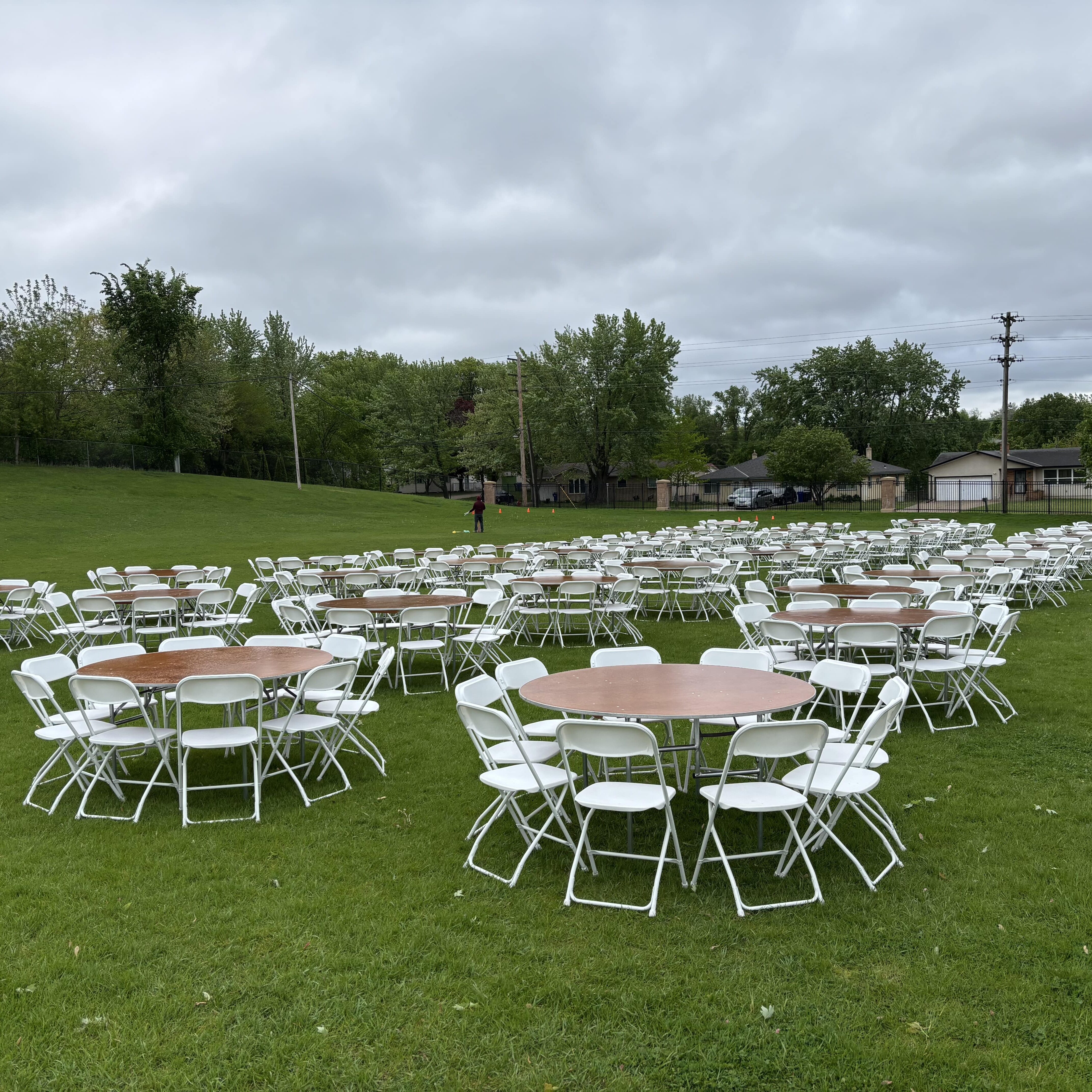 Round table and chairs on green grass