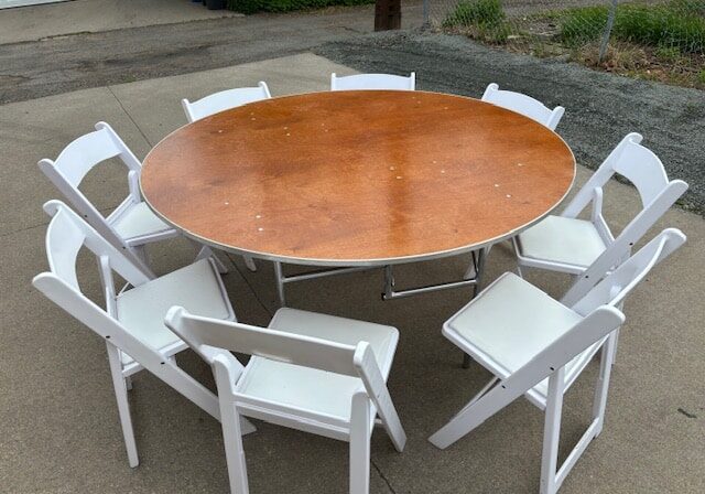 Round table with white chairs