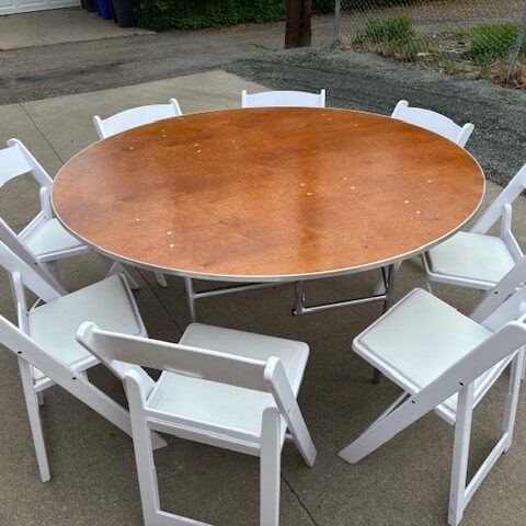 Round table with white chairs